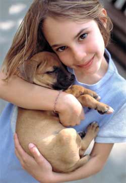 young girl with puppy